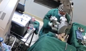 Doctor caught on video camera punching patient during surgery